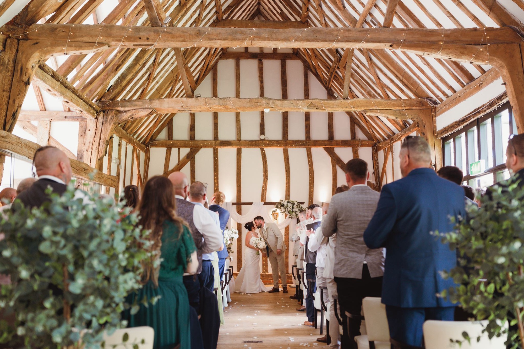 The barn aisle lined with fairy lights