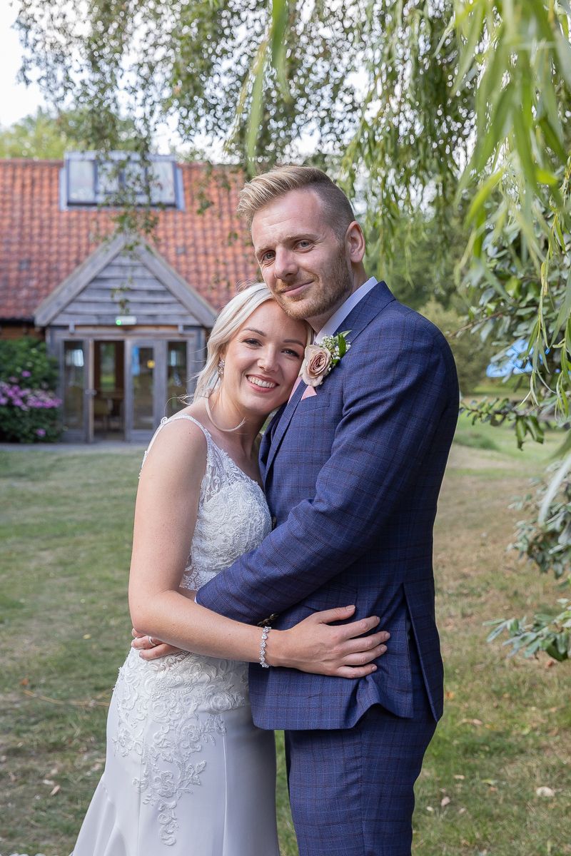 A couple share a quiet moment on their wedding day
