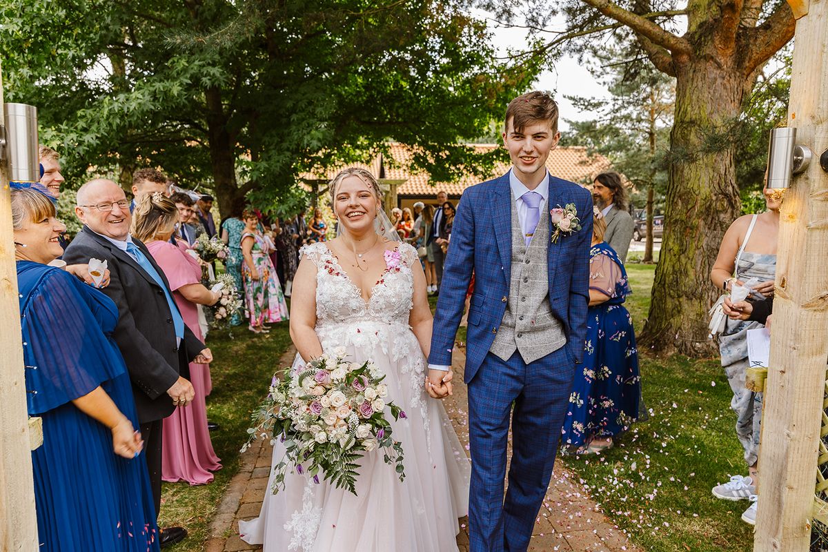 Confetti as the couple walk together